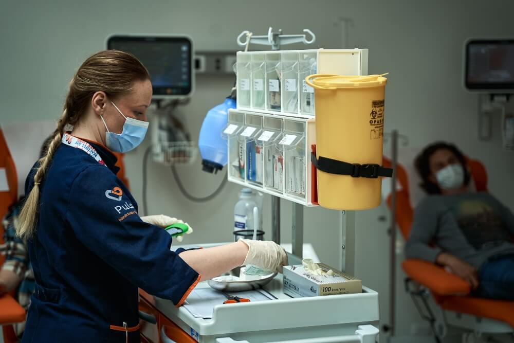 A nurse sorts the samples in the laboratory - Pulse Cardiology Center