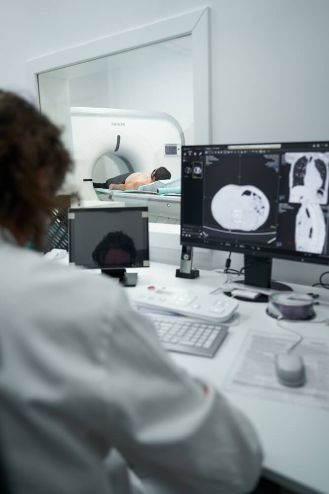 The medical staff examines the image of the patient from the CT scanner