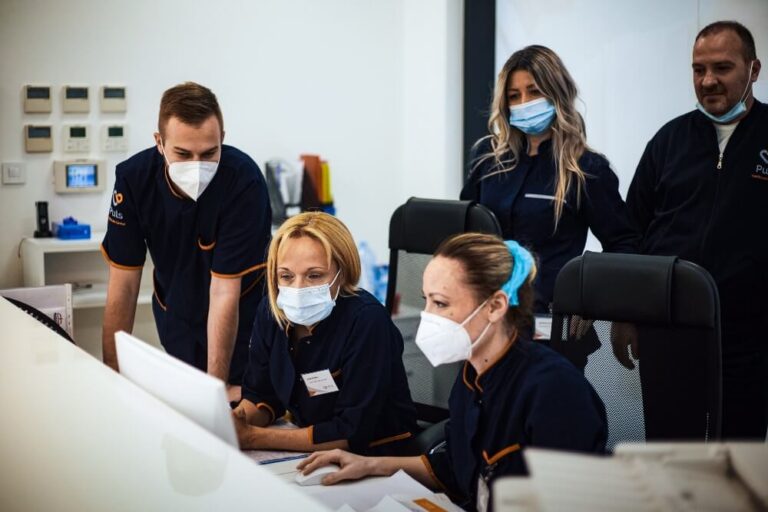 A Group of Doctors Are Looking at the Result of an Examination