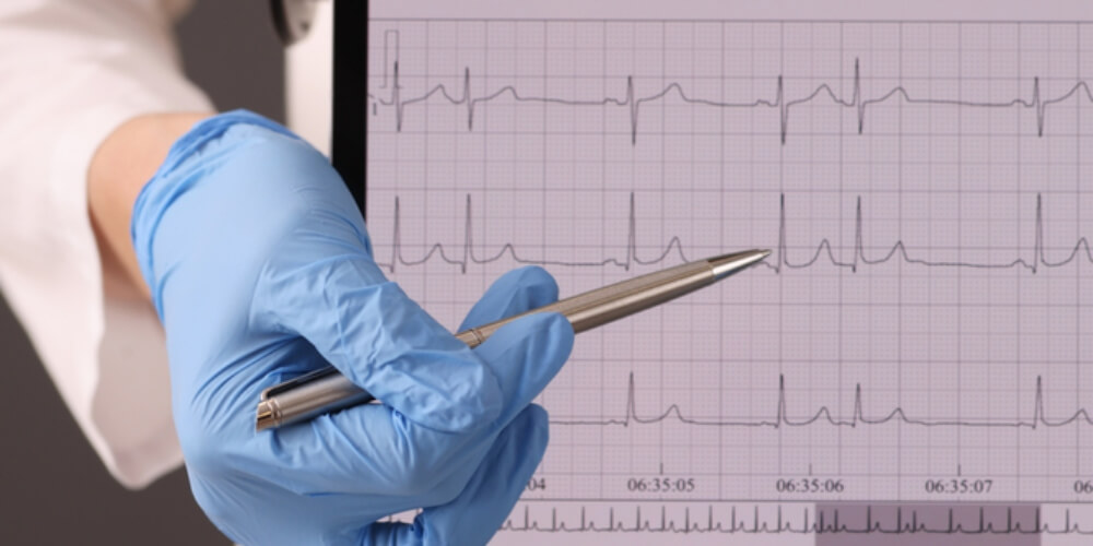 The doctor is pointing to a problem in the patient's heart function