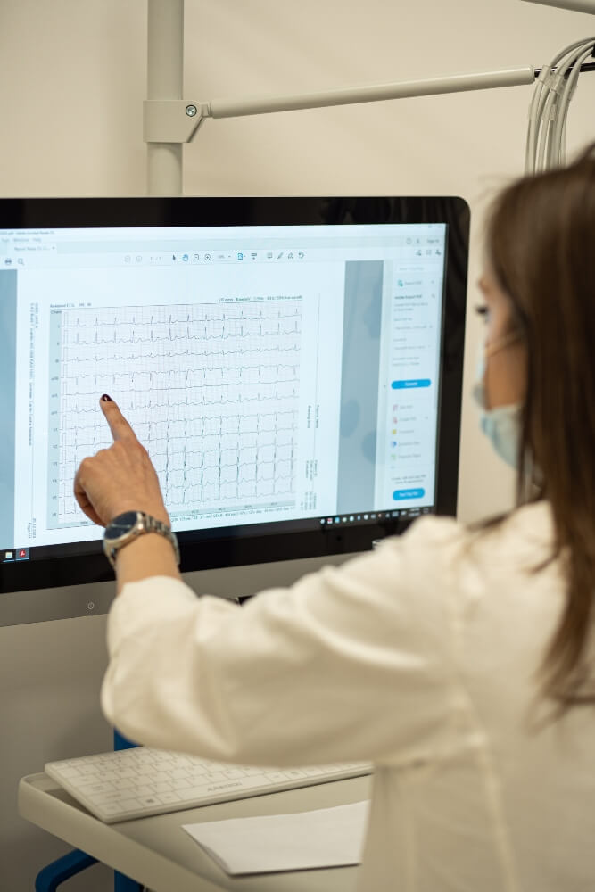 The doctor is interpreting the results after the echocardiogram -ECG