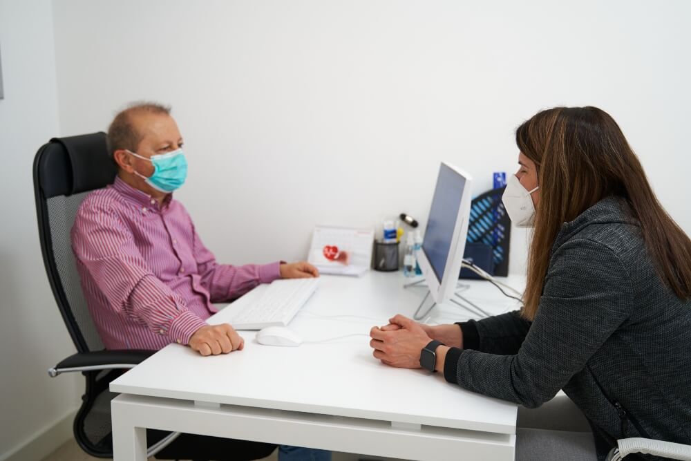 The female patient is attending a consultation at the Pulse Cardiology Center.