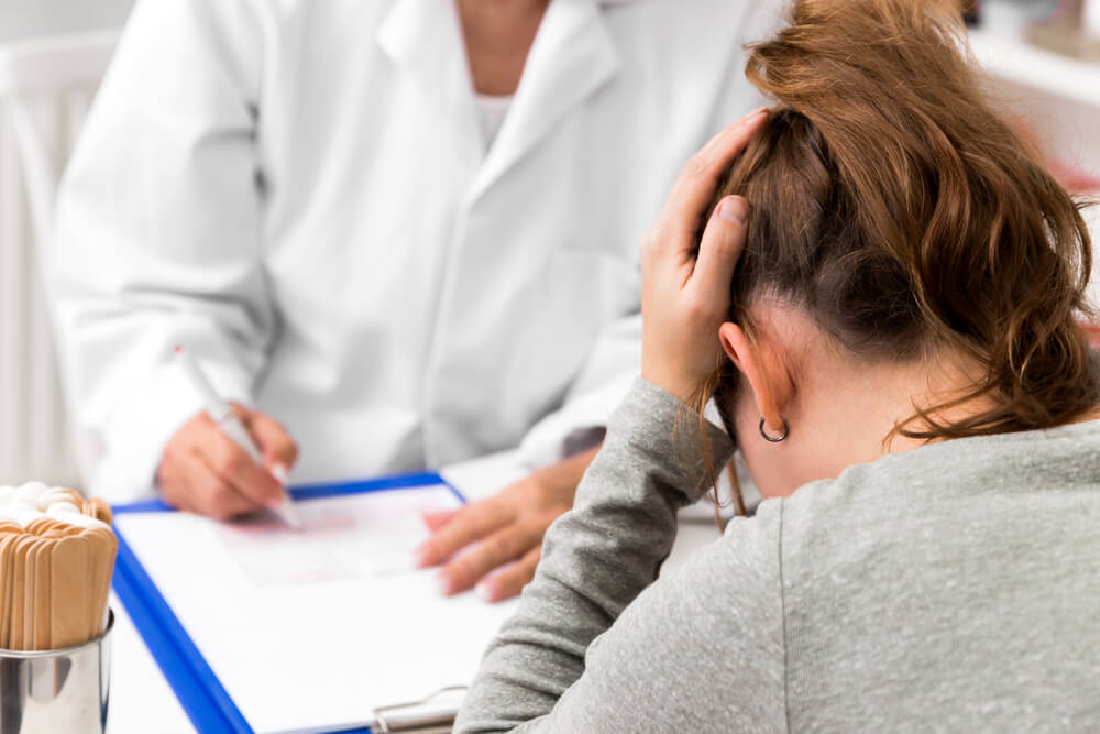 A teenage girl with a headache on examination