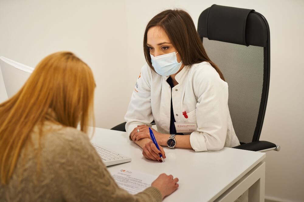The female patient is at a consultation with a doctor at the Pulse Cardiology Center