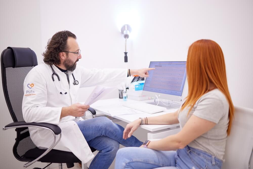 A patient being examined in a doctor's office at Pulse Cardiology Center