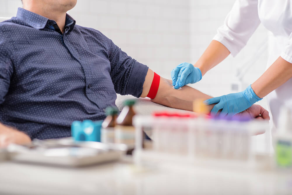 A nurse draws blood at Pulse Cardiology Center