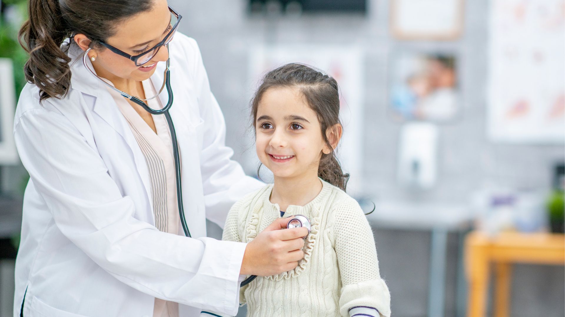 A pediatric cardiologist examines the child.